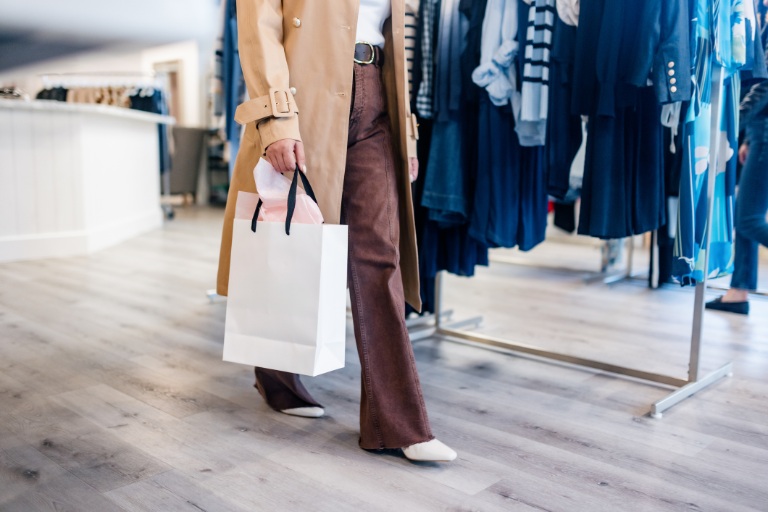 Customer Leaving Boutique Clothing Store